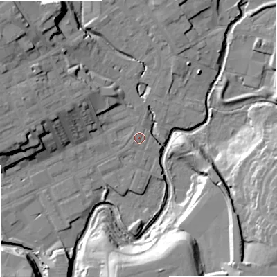 Shaded relief map of the ground around OL162JY, computed from Environment Agency LiDAR. The ground here sits at about 124 m above sea level and falls 25 m across the surrounding 800 m. Surface water reaching this point runs off ground lying to the west-north-west, 15.7 m higher.
