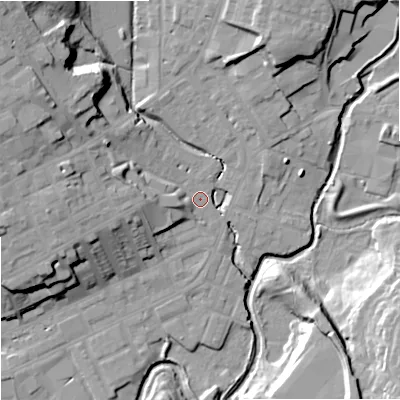 Shaded relief map of the ground around OL162JZ, computed from Environment Agency LiDAR. The ground here sits at about 125 m above sea level and falls 25 m across the surrounding 800 m. Surface water reaching this point runs off ground lying to the west, 16.3 m higher.
