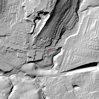 Shaded relief map of the ground around OL45SJ, computed from Environment Agency LiDAR. The ground here sits at about 203 m above sea level and falls 83 m across the surrounding 800 m. Surface water reaching this point runs off ground lying to the north-north-west, 39.4 m higher.