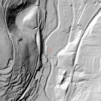 Shaded relief map of the ground around OL59AX, computed from Environment Agency LiDAR. The ground here sits at about 143 m above sea level and falls 94 m across the surrounding 800 m. Surface water reaching this point runs off ground lying to the north-north-east, 4.3 m higher.