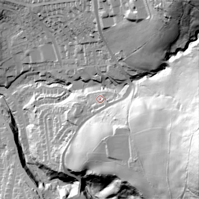 Shaded relief map of the ground around OL59LP, computed from Environment Agency LiDAR. The ground here sits at about 185 m above sea level and falls 131 m across the surrounding 800 m. Surface water reaching this point runs off ground lying to the south-east, 6.7 m higher.