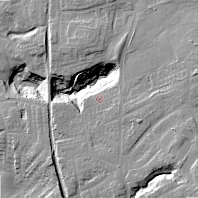 Shaded relief map of the ground around OL68TW, computed from Environment Agency LiDAR. The ground here sits at about 131 m above sea level and falls 32 m across the surrounding 800 m. Surface water reaching this point runs off ground lying to the east-south-east, 3.3 m higher.