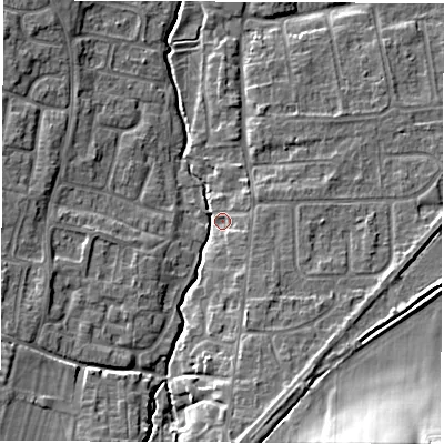 Shaded relief map of the ground around OX127JL, computed from Environment Agency LiDAR. The ground here sits at about 75 m above sea level and falls 16 m across the surrounding 800 m. Surface water reaching this point runs off ground lying to the south, 6.2 m higher.