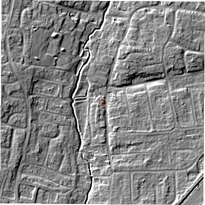 Shaded relief map of the ground around OX127JY, computed from Environment Agency LiDAR. The ground here sits at about 75 m above sea level and falls 7 m across the surrounding 800 m. Surface water reaching this point runs off ground lying to the south, 5.0 m higher.