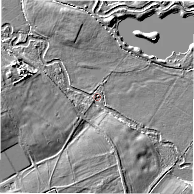 Shaded relief map of the ground around OX297PT, computed from Environment Agency LiDAR. The ground here sits at about 74 m above sea level and falls 10 m across the surrounding 800 m. Surface water reaching this point runs off ground lying to the west-south-west, 9.1 m higher.