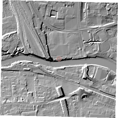 Shaded relief map of the ground around PE11ES, computed from Environment Agency LiDAR. The ground here sits at about 6 m above sea level and falls 9 m across the surrounding 800 m. Surface water reaching this point runs off ground lying to the west, 5.4 m higher.