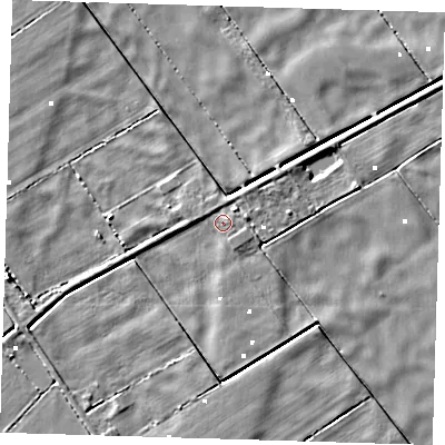 Shaded relief map of the ground around PE135PA, computed from Environment Agency LiDAR. The ground here sits at about 0 m above sea level and falls 4 m across the surrounding 800 m. Surface water reaching this point runs off ground lying to the east-north-east, 1.1 m higher.