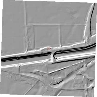 Shaded relief map of the ground around PE135RE, computed from Environment Agency LiDAR. The ground here sits at about 7 m above sea level and falls 11 m across the surrounding 800 m. Surface water reaching this point runs off ground lying to the east-south-east, 4.2 m higher.