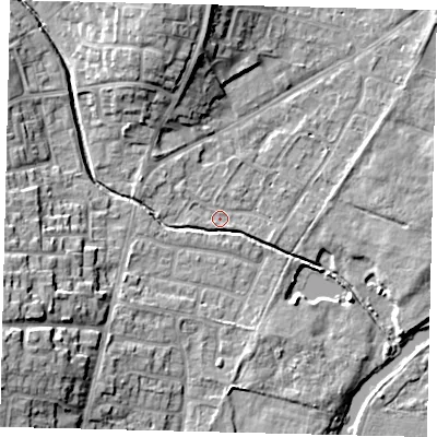 Shaded relief map of the ground around PE197JY, computed from Environment Agency LiDAR. The ground here sits at about 16 m above sea level and falls 15 m across the surrounding 800 m. Surface water reaching this point runs off ground lying to the west-south-west, 12.8 m higher.