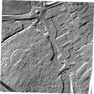 Shaded relief map of the ground around PE296UF, computed from Environment Agency LiDAR. The ground here sits at about 13 m above sea level and falls 12 m across the surrounding 800 m. Surface water reaching this point runs off ground lying to the west, 0.9 m higher.