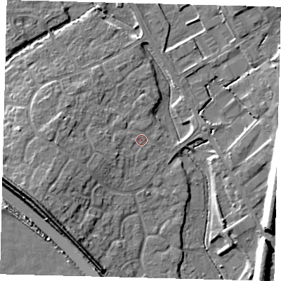 Shaded relief map of the ground around PE296XE, computed from Environment Agency LiDAR. The ground here sits at about 13 m above sea level and falls 12 m across the surrounding 800 m. Surface water reaching this point runs off ground lying to the west-south-west, 2.1 m higher.