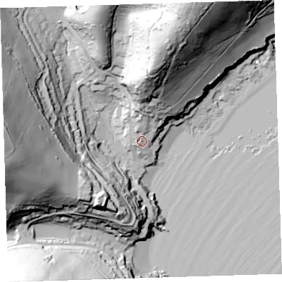 Shaded relief map of the ground around PL101NE, computed from Environment Agency LiDAR. The ground here sits at about 12 m above sea level and falls 92 m across the surrounding 800 m. Surface water reaching this point runs off ground lying to the north, 35.4 m higher.