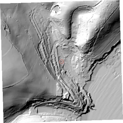 Shaded relief map of the ground around PL101PA, computed from Environment Agency LiDAR. The ground here sits at about 12 m above sea level and falls 107 m across the surrounding 800 m. Surface water reaching this point runs off ground lying to the west-south-west, 73.9 m higher.