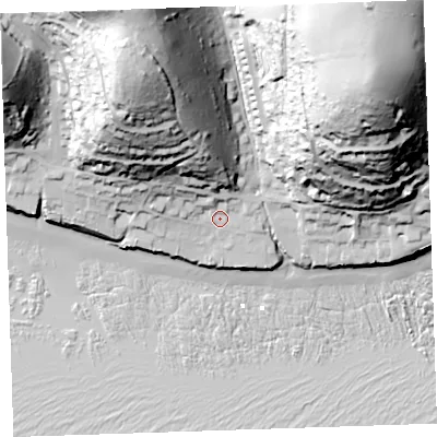 Shaded relief map of the ground around PL113LW, computed from Environment Agency LiDAR. The ground here sits at about 13 m above sea level and falls 112 m across the surrounding 800 m. Surface water reaching this point runs off ground lying to the north, 6.1 m higher.