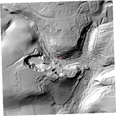 Shaded relief map of the ground around PL124QF, computed from Environment Agency LiDAR. The ground here sits at about 21 m above sea level and falls 79 m across the surrounding 800 m. Surface water reaching this point runs off ground lying to the west-south-west, 63.6 m higher.