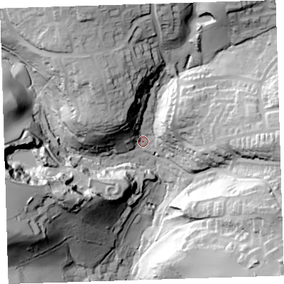 Shaded relief map of the ground around PL124XB, computed from Environment Agency LiDAR. The ground here sits at about 16 m above sea level and falls 70 m across the surrounding 800 m. Surface water reaching this point runs off ground lying to the north-north-west, 45.5 m higher.