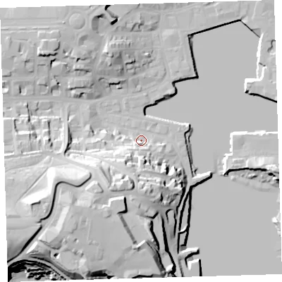 Shaded relief map of the ground around PL12JT, computed from Environment Agency LiDAR. The ground here sits at about 4 m above sea level and falls 38 m across the surrounding 800 m. Surface water reaching this point runs off ground lying to the south, 18.5 m higher.