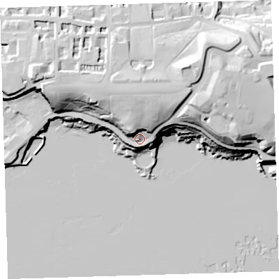 Shaded relief map of the ground around PL12NZ, computed from Environment Agency LiDAR. The ground here sits at about 19 m above sea level and falls 38 m across the surrounding 800 m. Surface water reaching this point runs off ground lying to the north, 18.2 m higher.