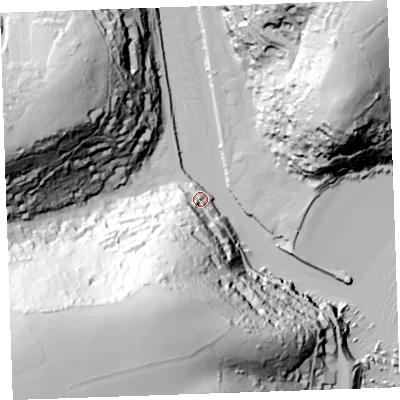 Shaded relief map of the ground around PL132BY, computed from Environment Agency LiDAR. The ground here sits at about 9 m above sea level and falls 105 m across the surrounding 800 m. Surface water reaching this point runs off ground lying to the south-south-west, 65.2 m higher.