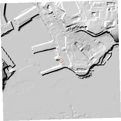 Shaded relief map of the ground around PL13TG, computed from Environment Agency LiDAR. The ground here sits at about 5 m above sea level and falls 35 m across the surrounding 800 m. Surface water reaching this point runs off ground lying to the north-north-east, 11.6 m higher.