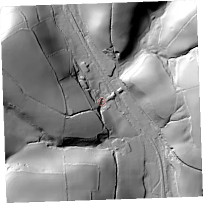 Shaded relief map of the ground around PL144SH, computed from Environment Agency LiDAR. The ground here sits at about 25 m above sea level and falls 79 m across the surrounding 800 m. Surface water reaching this point runs off ground lying to the west-north-west, 60.7 m higher.