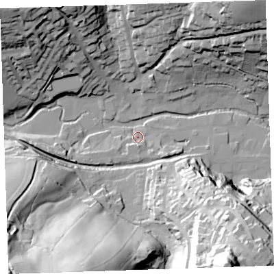 Shaded relief map of the ground around PL158EJ, computed from Environment Agency LiDAR. The ground here sits at about 69 m above sea level and falls 91 m across the surrounding 800 m. Surface water reaching this point runs off ground lying to the south, 5.6 m higher.