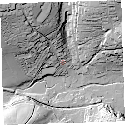 Shaded relief map of the ground around PL158HN, computed from Environment Agency LiDAR. The ground here sits at about 77 m above sea level and falls 74 m across the surrounding 800 m. Surface water reaching this point runs off ground lying to the north-west, 64.9 m higher.