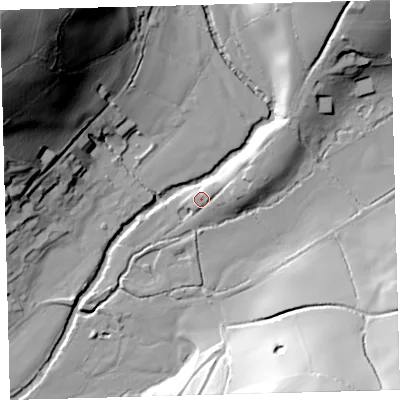 Shaded relief map of the ground around PL210LH, computed from Environment Agency LiDAR. The ground here sits at about 15 m above sea level and falls 90 m across the surrounding 800 m. Surface water reaching this point runs off ground lying to the east-north-east, 6.7 m higher.