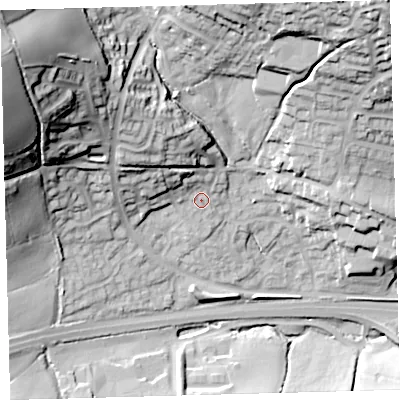 Shaded relief map of the ground around PL219TU, computed from Environment Agency LiDAR. The ground here sits at about 57 m above sea level and falls 62 m across the surrounding 800 m. Surface water reaching this point runs off ground lying to the north-west, 7.8 m higher.