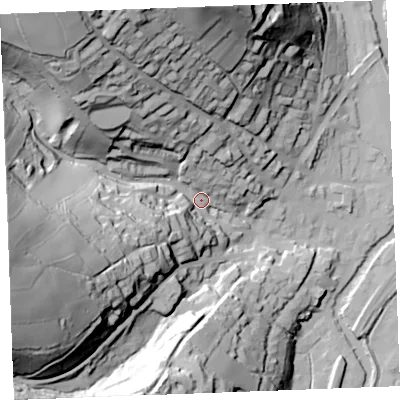 Shaded relief map of the ground around PL220AY, computed from Environment Agency LiDAR. The ground here sits at about 16 m above sea level and falls 97 m across the surrounding 800 m. Surface water reaching this point runs off ground lying to the west-south-west, 86.0 m higher.