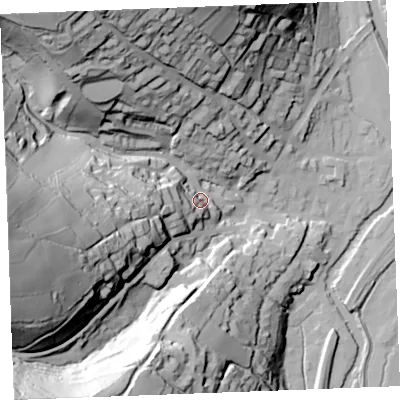 Shaded relief map of the ground around PL220DL, computed from Environment Agency LiDAR. The ground here sits at about 18 m above sea level and falls 95 m across the surrounding 800 m. Surface water reaching this point runs off ground lying to the west, 29.6 m higher.