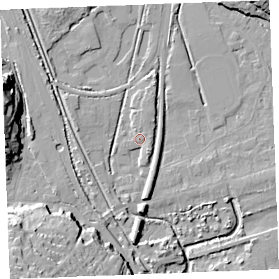 Shaded relief map of the ground around PL242AE, computed from Environment Agency LiDAR. The ground here sits at about 5 m above sea level and falls 31 m across the surrounding 800 m. Surface water reaching this point runs off ground lying to the north-north-east, 2.0 m higher.