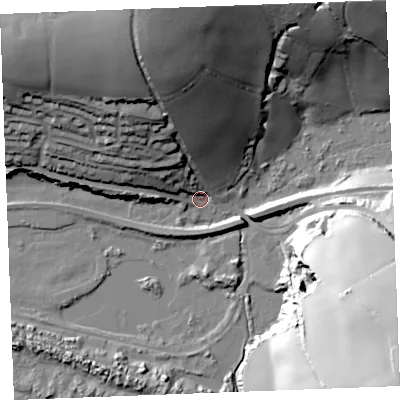 Shaded relief map of the ground around PL242AT, computed from Environment Agency LiDAR. The ground here sits at about 5 m above sea level and falls 66 m across the surrounding 800 m. Surface water reaching this point runs off ground lying to the north-north-west, 46.3 m higher.