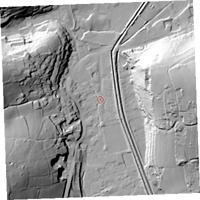 Shaded relief map of the ground around PL242AX, computed from Environment Agency LiDAR. The ground here sits at about 5 m above sea level and falls 64 m across the surrounding 800 m. Surface water reaching this point runs off ground lying to the west-north-west, 51.6 m higher.