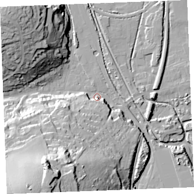 Shaded relief map of the ground around PL242BB, computed from Environment Agency LiDAR. The ground here sits at about 5 m above sea level and falls 64 m across the surrounding 800 m. Surface water reaching this point runs off ground lying to the south-south-west, 57.0 m higher.