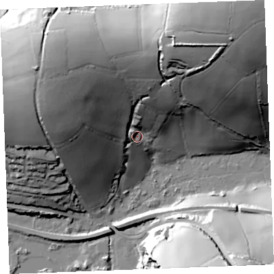 Shaded relief map of the ground around PL242TW, computed from Environment Agency LiDAR. The ground here sits at about 15 m above sea level and falls 85 m across the surrounding 800 m. Surface water reaching this point runs off ground lying to the north-north-east, 39.7 m higher.