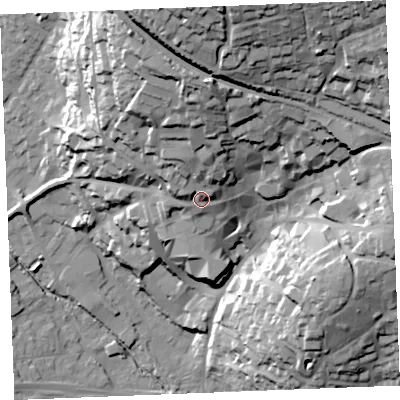 Shaded relief map of the ground around PL255EP, computed from Environment Agency LiDAR. The ground here sits at about 65 m above sea level and falls 77 m across the surrounding 800 m. Surface water reaching this point runs off ground lying to the north, 21.4 m higher.