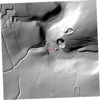 Shaded relief map of the ground around PL266NB, computed from Environment Agency LiDAR. The ground here sits at about 12 m above sea level and falls 69 m across the surrounding 800 m. Surface water reaching this point runs off ground lying to the west-north-west, 61.4 m higher.