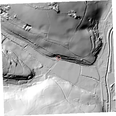 Shaded relief map of the ground around PL267AT, computed from Environment Agency LiDAR. The ground here sits at about 21 m above sea level and falls 80 m across the surrounding 800 m. Surface water reaching this point runs off ground lying to the north, 62.8 m higher.