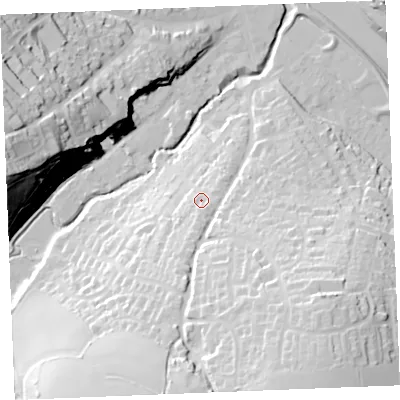 Shaded relief map of the ground around PL277PB, computed from Environment Agency LiDAR. The ground here sits at about 18 m above sea level and falls 53 m across the surrounding 800 m. Surface water reaching this point runs off ground lying to the south, 9.0 m higher.
