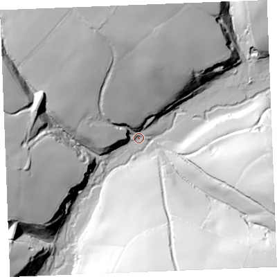 Shaded relief map of the ground around PL303BP, computed from Environment Agency LiDAR. The ground here sits at about 17 m above sea level and falls 69 m across the surrounding 800 m. Surface water reaching this point runs off ground lying to the north-north-west, 40.6 m higher.