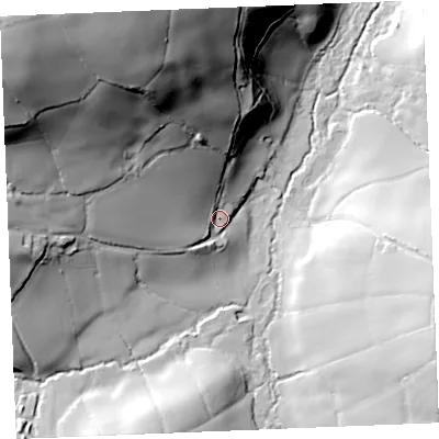 Shaded relief map of the ground around PL305PD, computed from Environment Agency LiDAR. The ground here sits at about 65 m above sea level and falls 98 m across the surrounding 800 m. Surface water reaching this point runs off ground lying to the north-west, 86.2 m higher.