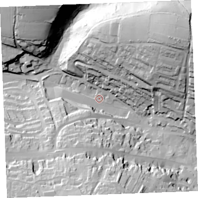 Shaded relief map of the ground around PL312NP, computed from Environment Agency LiDAR. The ground here sits at about 71 m above sea level and falls 64 m across the surrounding 800 m. Surface water reaching this point runs off ground lying to the south, 55.6 m higher.