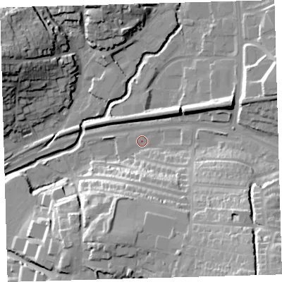 Shaded relief map of the ground around PL72XT, computed from Environment Agency LiDAR. The ground here sits at about 11 m above sea level and falls 38 m across the surrounding 800 m. Surface water reaching this point runs off ground lying to the south-east, 25.1 m higher.