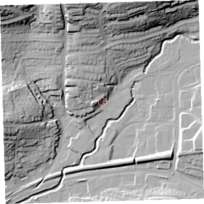 Shaded relief map of the ground around PL74AW, computed from Environment Agency LiDAR. The ground here sits at about 13 m above sea level and falls 45 m across the surrounding 800 m. Surface water reaching this point runs off ground lying to the north-north-west, 10.1 m higher.