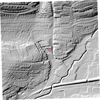 Shaded relief map of the ground around PL74DE, computed from Environment Agency LiDAR. The ground here sits at about 16 m above sea level and falls 59 m across the surrounding 800 m. Surface water reaching this point runs off ground lying to the north-west, 53.6 m higher.