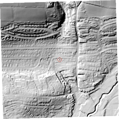 Shaded relief map of the ground around PL74HR, computed from Environment Agency LiDAR. The ground here sits at about 21 m above sea level and falls 86 m across the surrounding 800 m. Surface water reaching this point runs off ground lying to the north-east, 6.0 m higher.