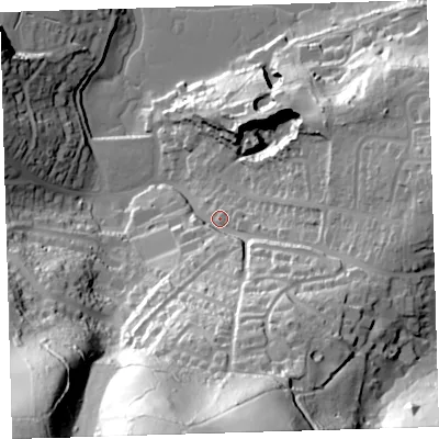 Shaded relief map of the ground around PL99QS, computed from Environment Agency LiDAR. The ground here sits at about 12 m above sea level and falls 98 m across the surrounding 800 m. Surface water reaching this point runs off ground lying to the south, 80.3 m higher.