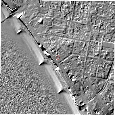 Shaded relief map of the ground around PO139LW, computed from Environment Agency LiDAR. The ground here sits at about 9 m above sea level and falls 12 m across the surrounding 800 m. Surface water reaching this point runs off ground lying to the north, 1.1 m higher.