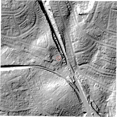 Shaded relief map of the ground around PO156AW, computed from Environment Agency LiDAR. The ground here sits at about 21 m above sea level and falls 29 m across the surrounding 800 m. Surface water reaching this point runs off ground lying to the north-north-west, 7.3 m higher.